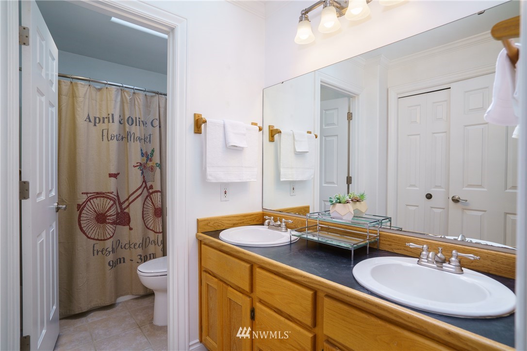 1230 Cedar Circle Langley, WA 98260 - Photo 19 of 39 a bathroom with a granite countertop sink and a mirror