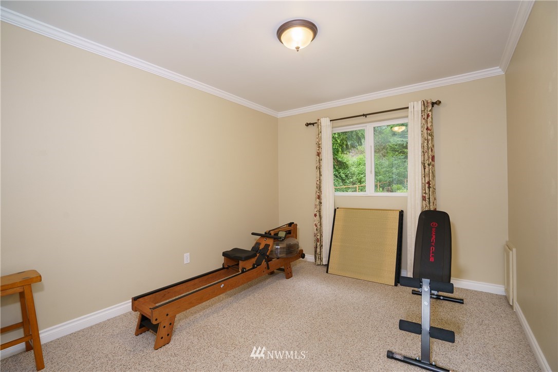 1230 Cedar Circle Langley, WA 98260 - Photo 20 of 39 a room with gym equipment and a window