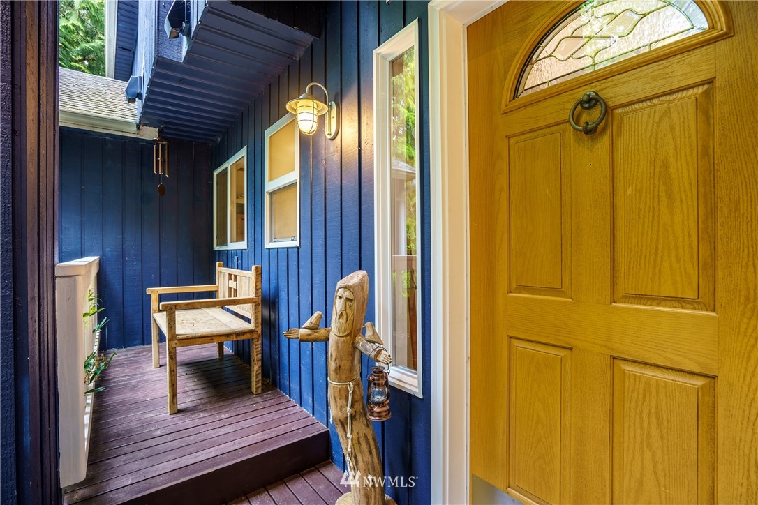 1230 Cedar Circle Langley, WA 98260 - Photo 3 of 39 a view of a balcony with furniture and wooden floor