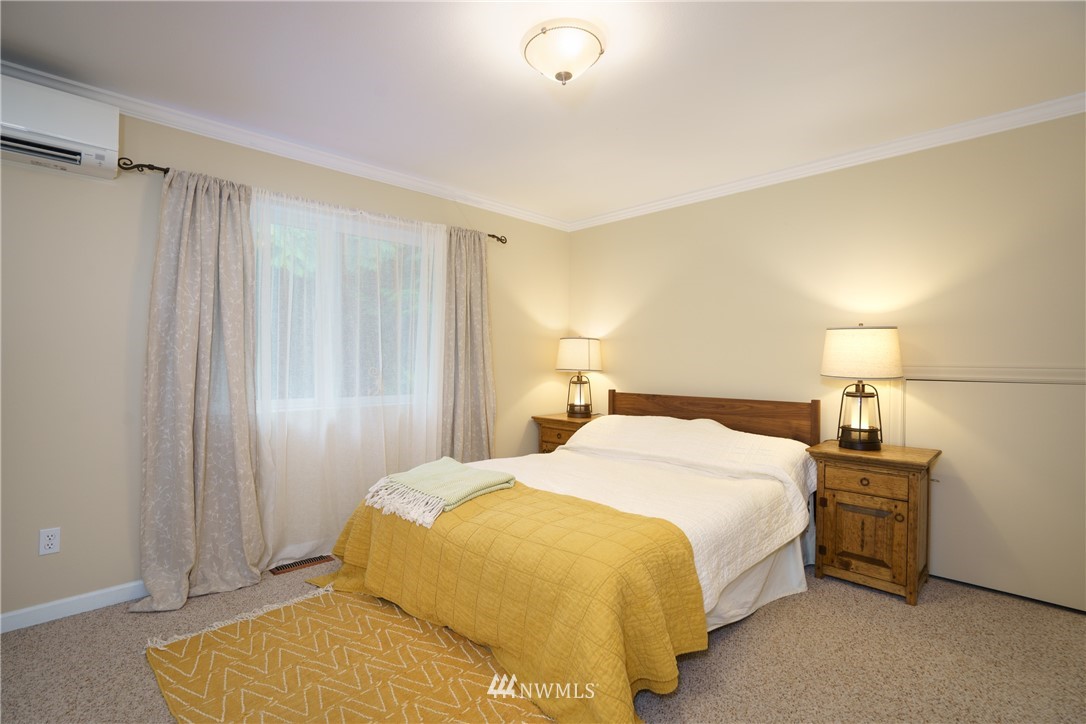 1230 Cedar Circle Langley, WA 98260 - Photo 23 of 39 a bedroom with a bed and a night stand