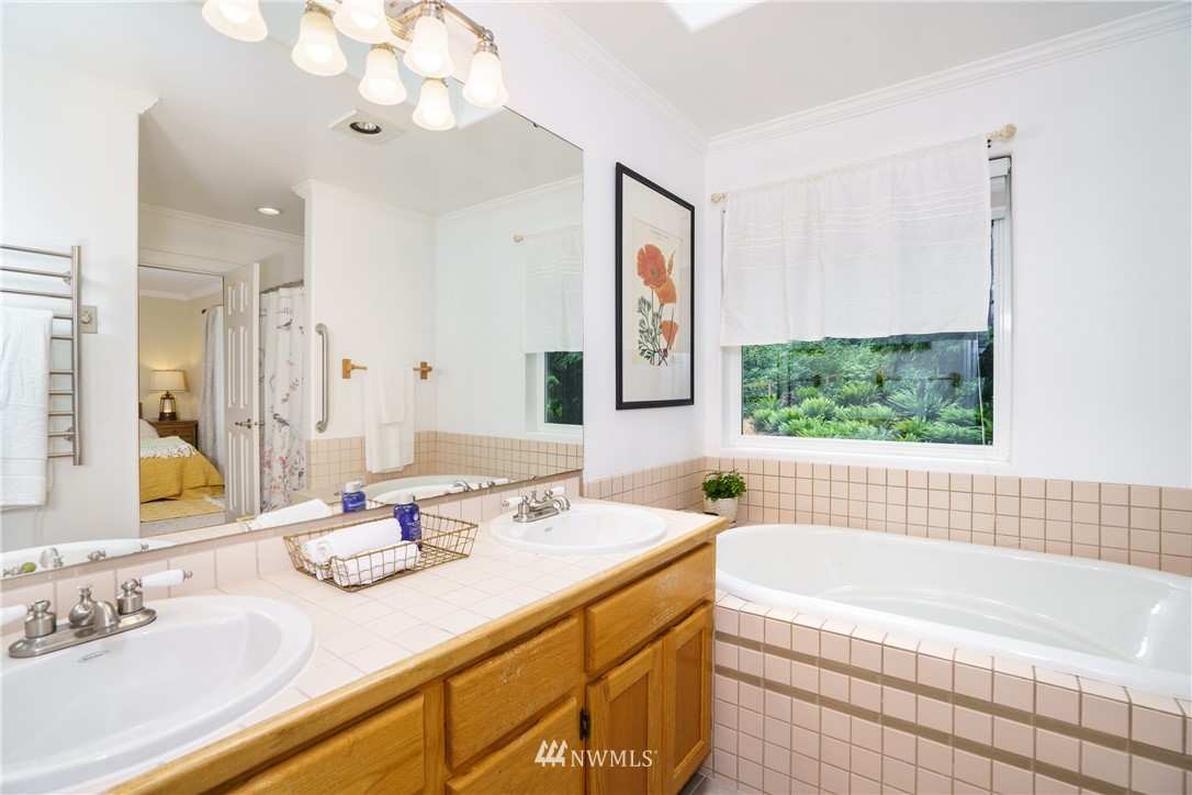 1230 Cedar Circle Langley, WA 98260 - Photo 24 of 39 a bathroom with a granite countertop sink mirror and bathtub