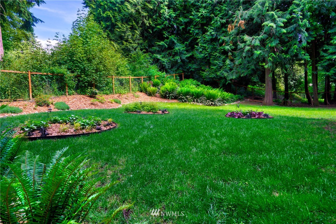 1230 Cedar Circle Langley, WA 98260 - Photo 27 of 39 a view of a house with a big yard and potted plants