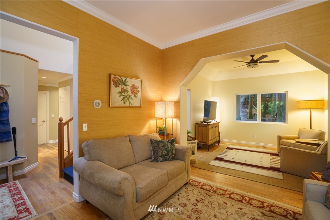 1230 Cedar Circle Langley, WA 98260 - Photo 6 of 39 a living room with couches and kitchen view with wooden floor