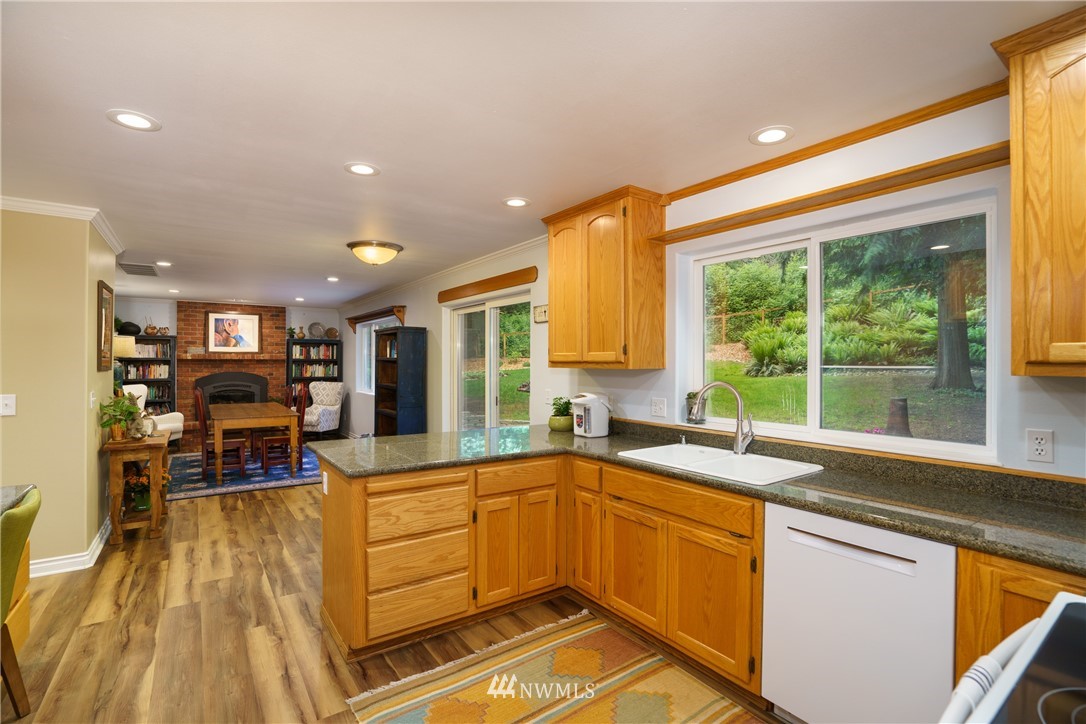 1230 Cedar Circle Langley, WA 98260 - Photo 9 of 39 a kitchen that has a sink and cabinets