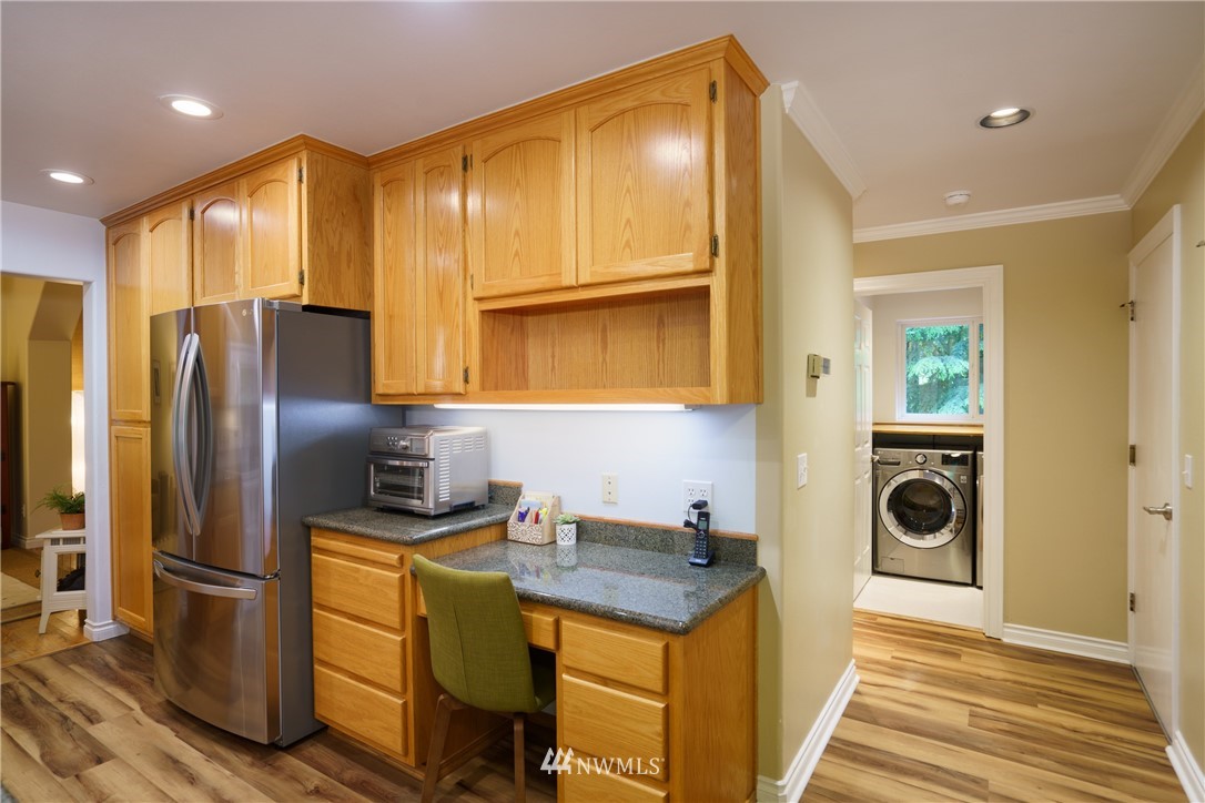 1230 Cedar Circle Langley, WA 98260 - Photo 10 of 39 a kitchen with a refrigerator and a sink