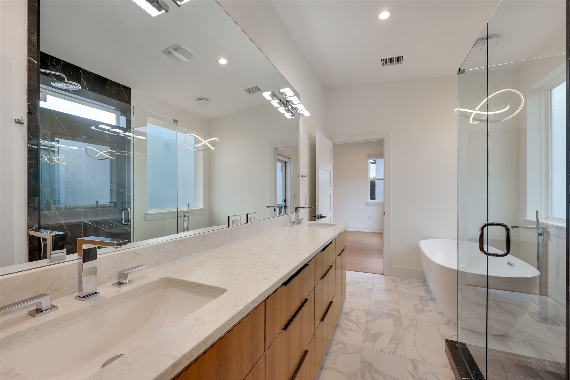 108 Tillery Street, Unit 1 Austin, TX 78702 - Photo 17 of 40 a spacious bathroom with a double vanity sink mirror and double