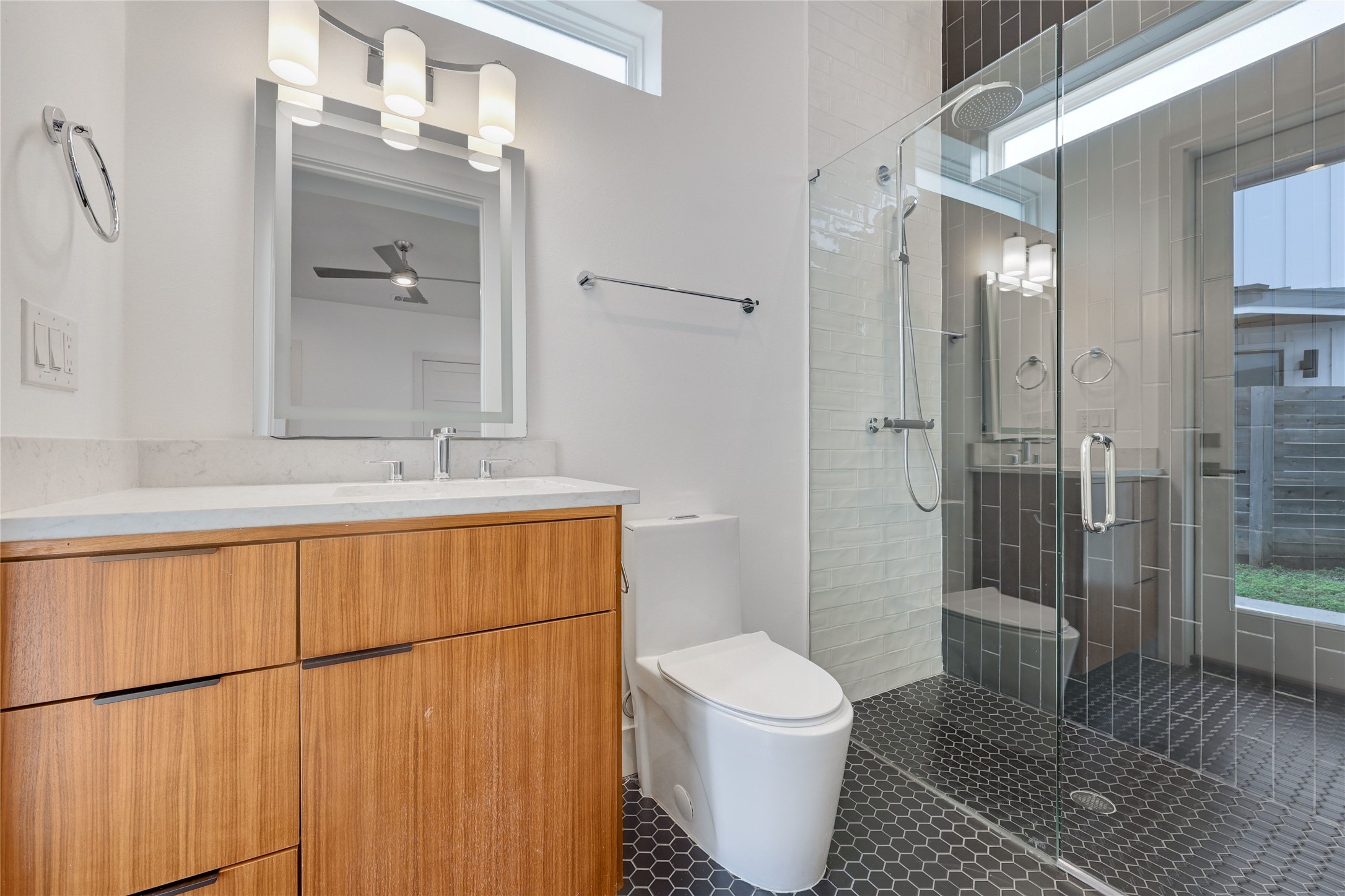 108 Tillery Street, Unit 1 Austin, TX 78702 - Photo 22 of 40 a bathroom with a sink toilet and shower