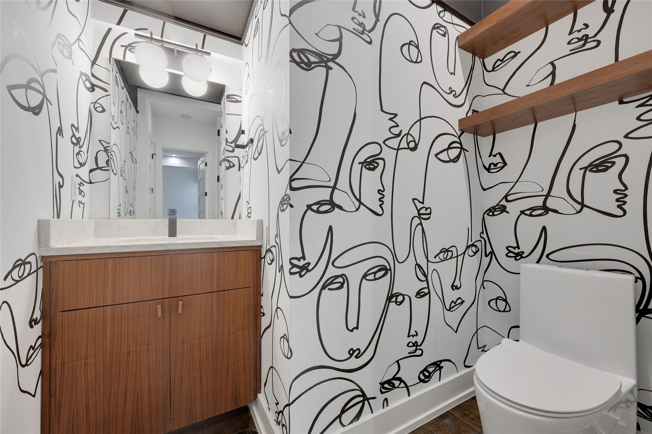 108 Tillery Street, Unit 1 Austin, TX 78702 - Photo 26 of 40 a bathroom with a toilet sink and mirror