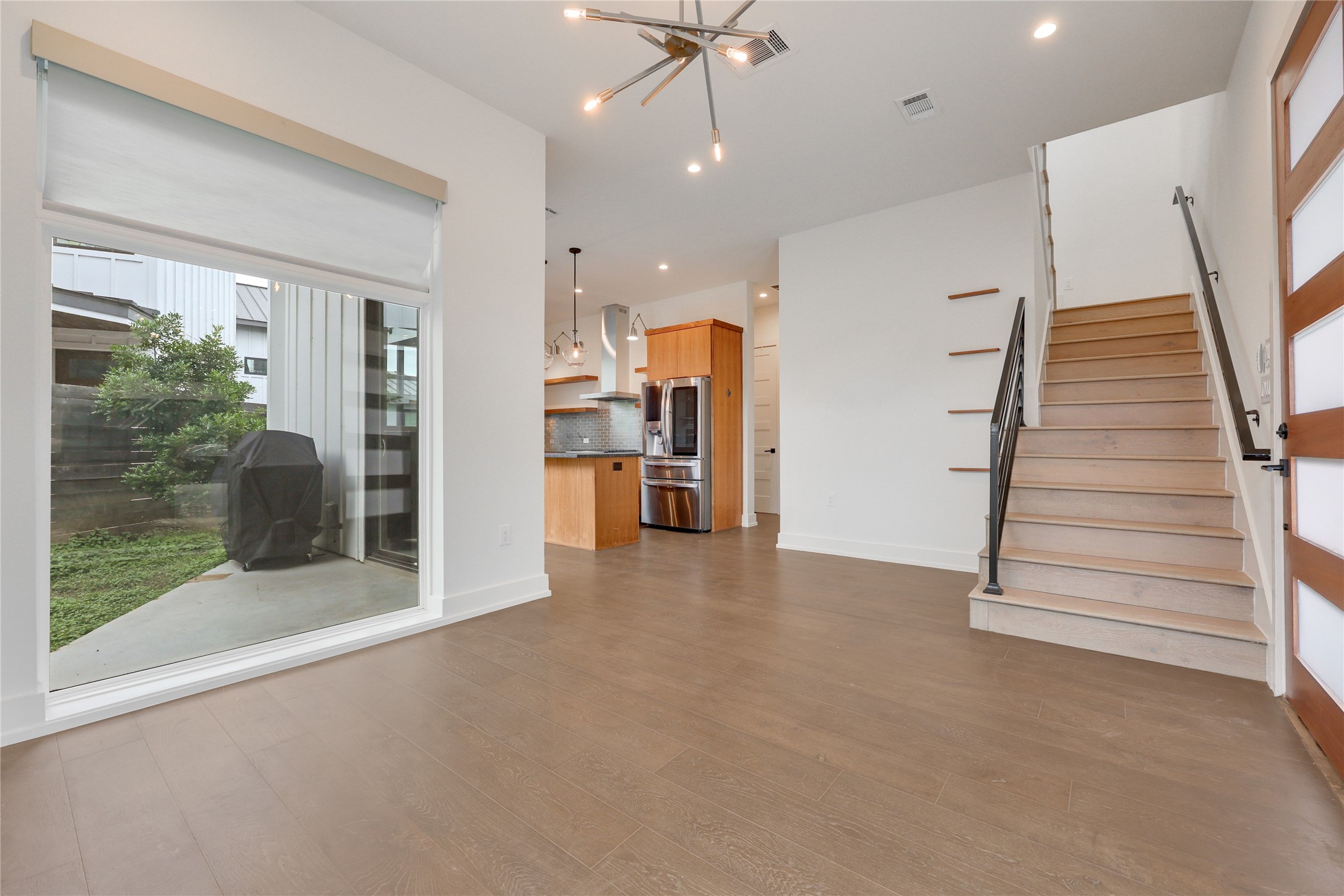 108 Tillery Street, Unit 1 Austin, TX 78702 - Photo 5 of 40 a view of an empty room with a fireplace and a window