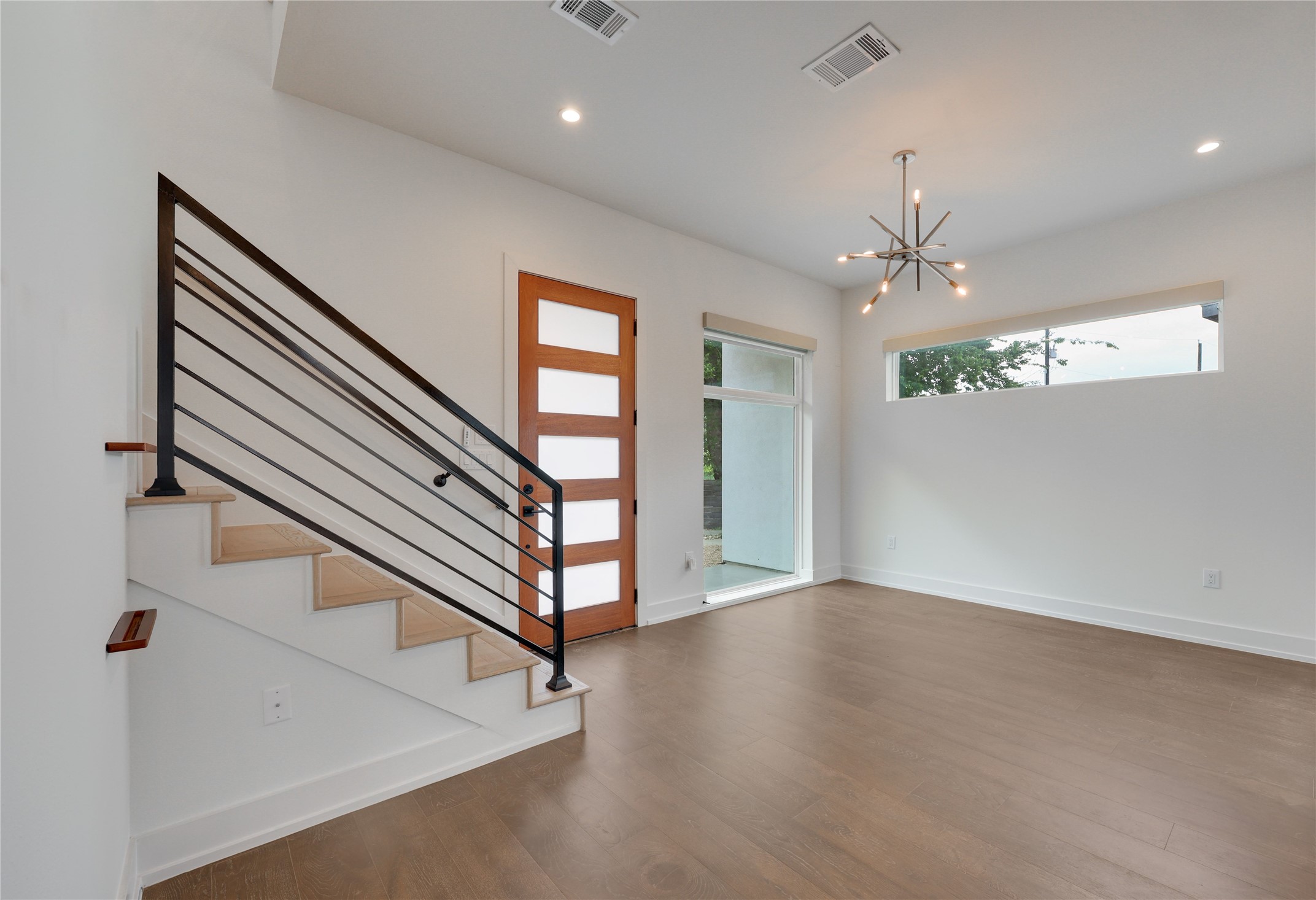 108 Tillery Street, Unit 1 Austin, TX 78702 - Photo 6 of 40 wooden floor in an empty room with a window