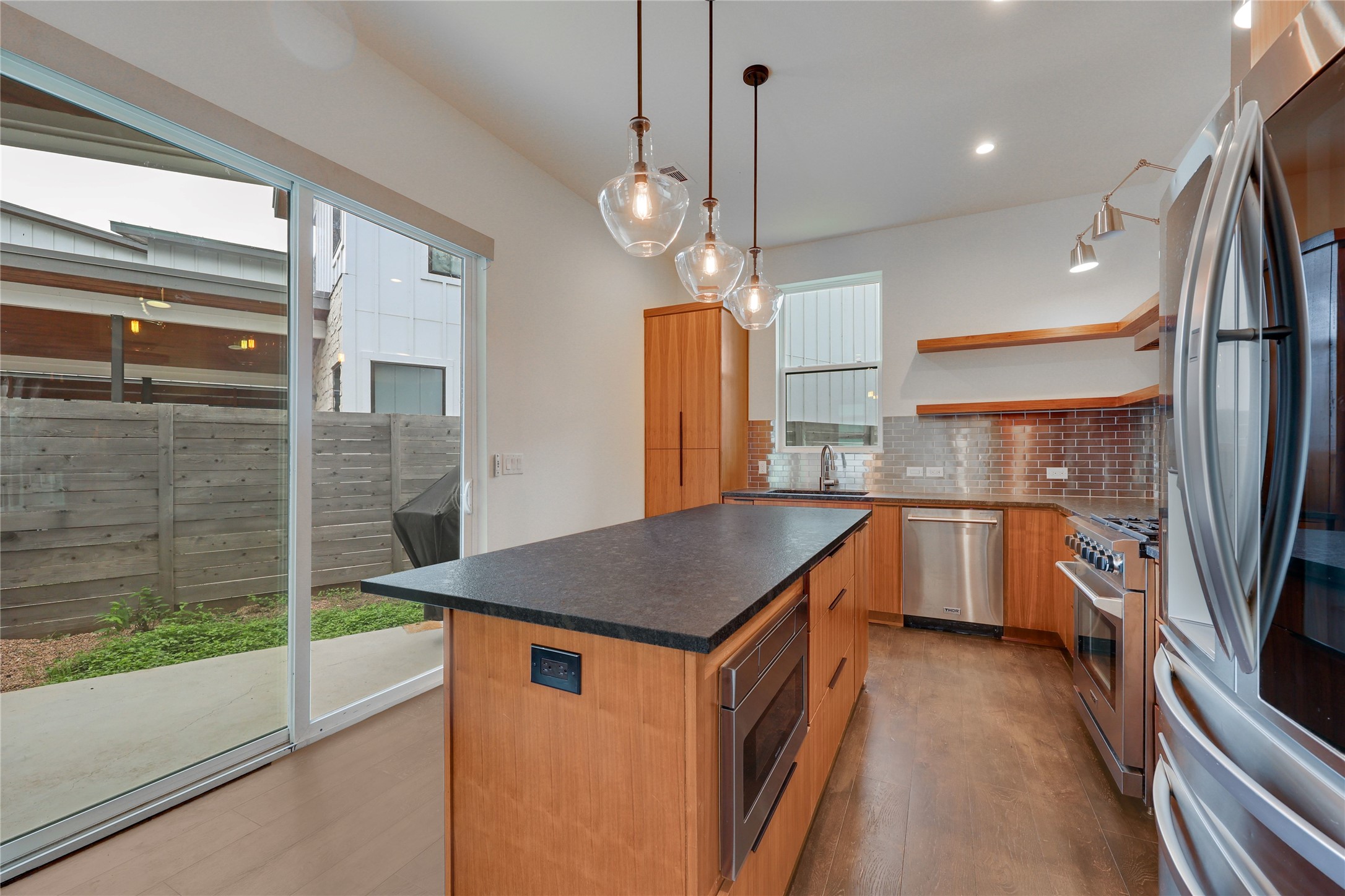 108 Tillery Street, Unit 1 Austin, TX 78702 - Photo 8 of 40 a kitchen that has a lot of cabinets and wooden floor