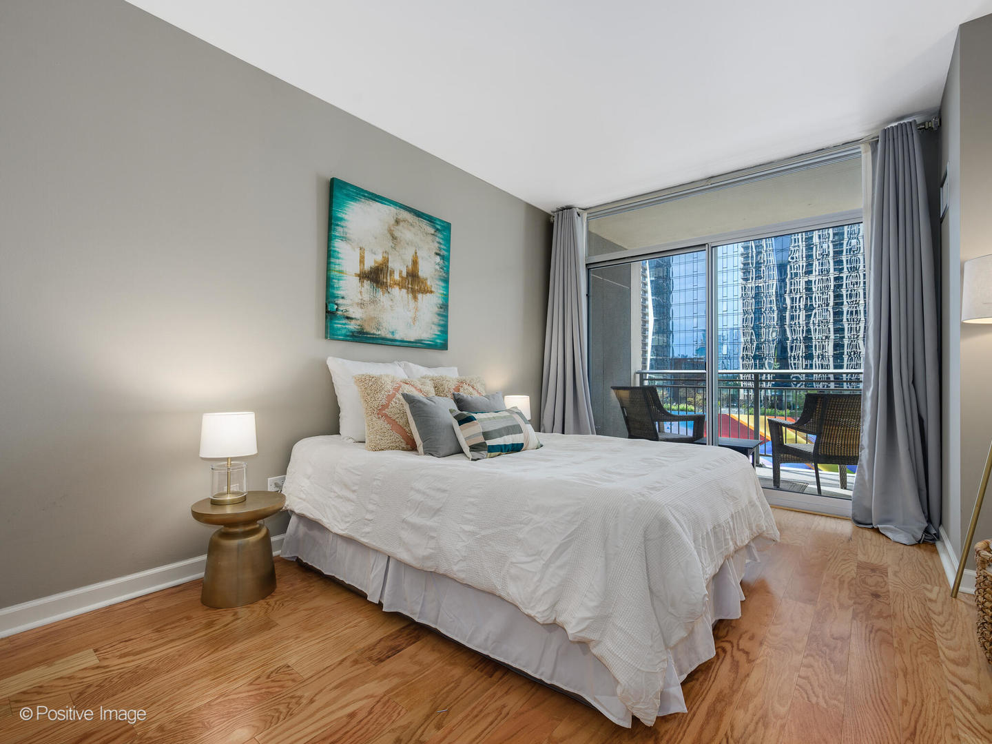 1250 South Michigan Avenue, Unit 910 Chicago, IL 60605 - Photo 11 of 26 a bedroom with a large bed and a window