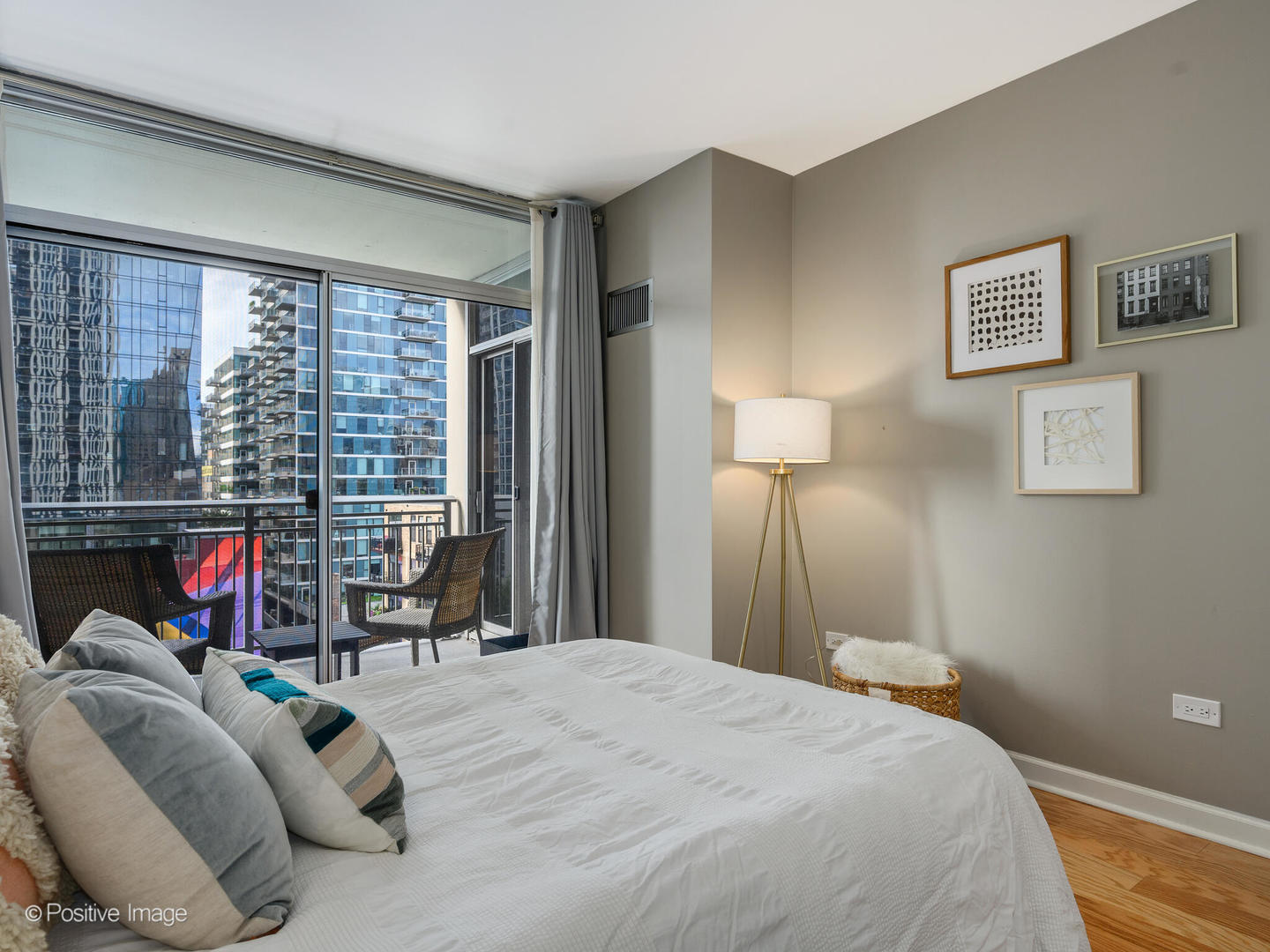 1250 South Michigan Avenue, Unit 910 Chicago, IL 60605 - Photo 12 of 26 a bedroom with a bed and a large window