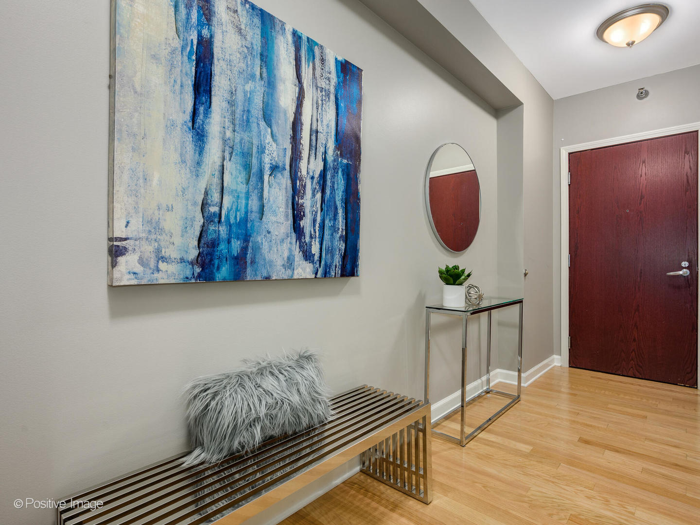 1250 South Michigan Avenue, Unit 910 Chicago, IL 60605 - Photo 2 of 26 a room with furniture and a wooden floor