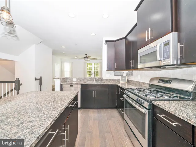 a view of a kitchen with a sink and dishwasher kitchen view