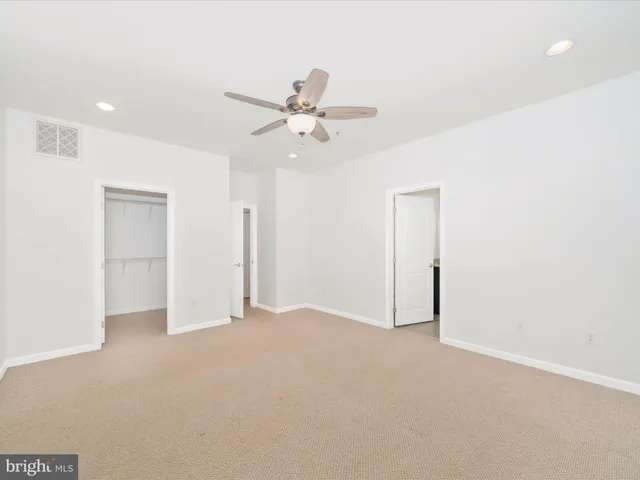 a white toilet sitting next to a bathroom sink