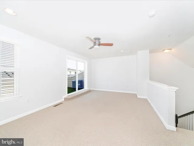 a view of a backyard with a garden and stairs