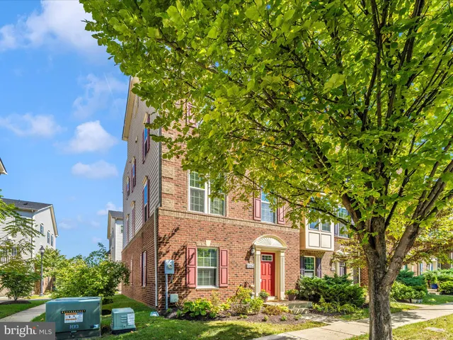 a view of a brick building next to a blue building