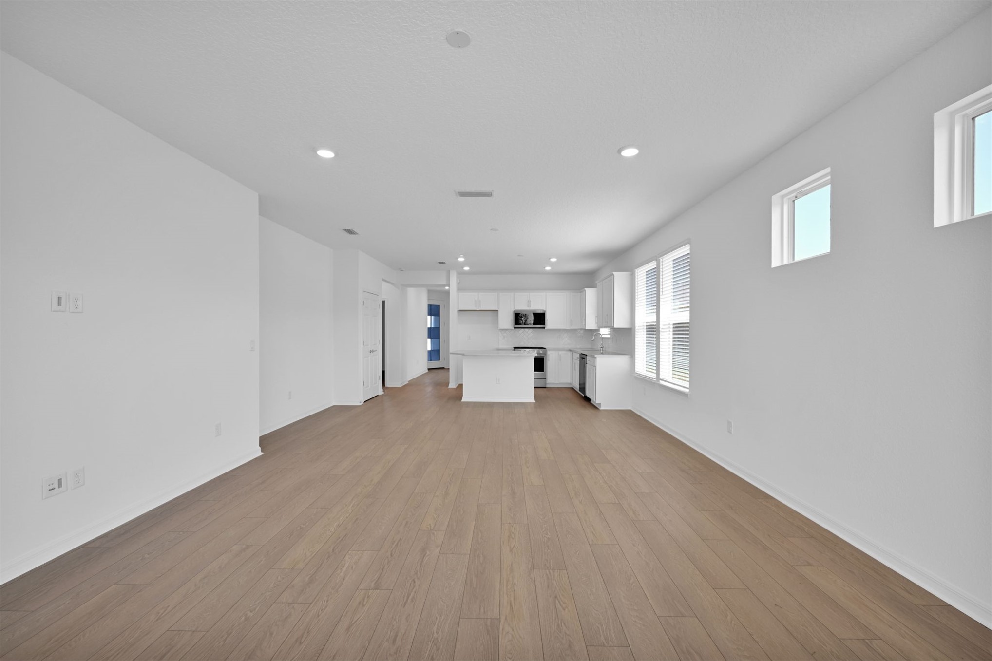 328 Ecliptic Loop Yulee, FL 32097 - Photo 14 of 41 a view of empty room with wooden floor