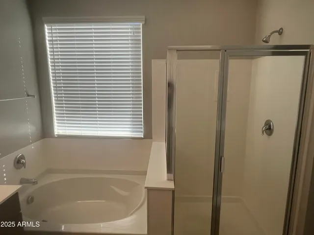 a white bath tub sitting next to a window