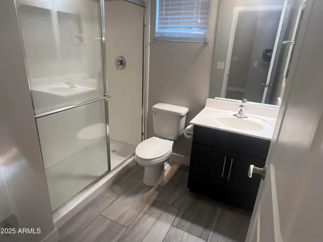 a bathroom with a toilet and a sink