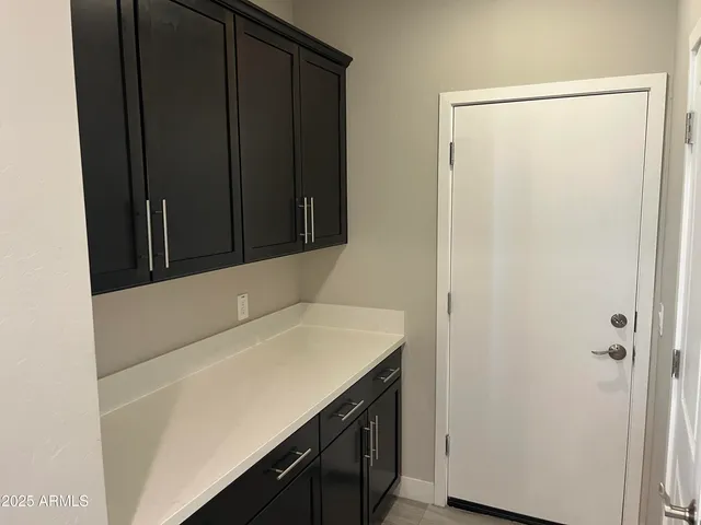 a bathroom with a sink and vanity