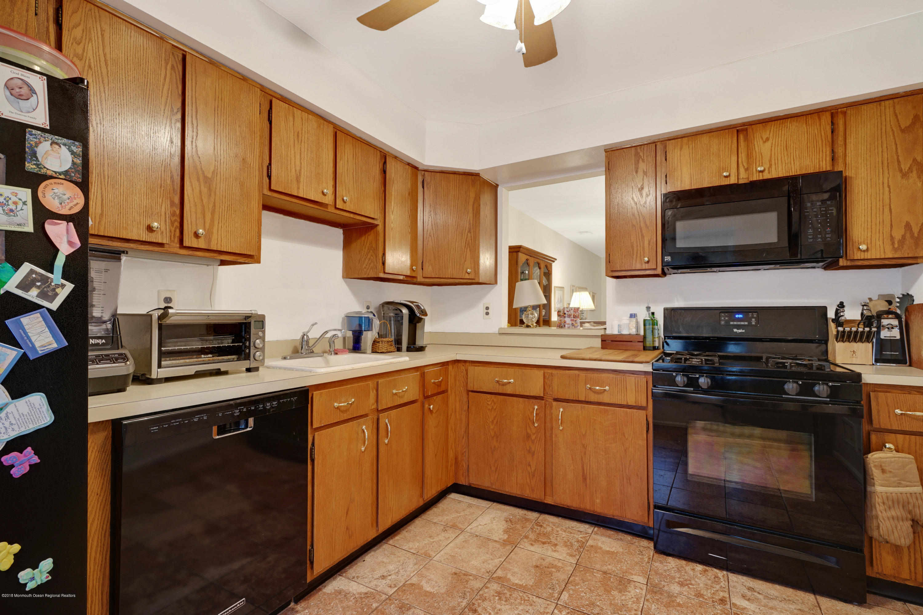 275 Gloucester Court Aberdeen, NJ 07747 - Photo 11 of 31 a kitchen with a sink stove and microwave