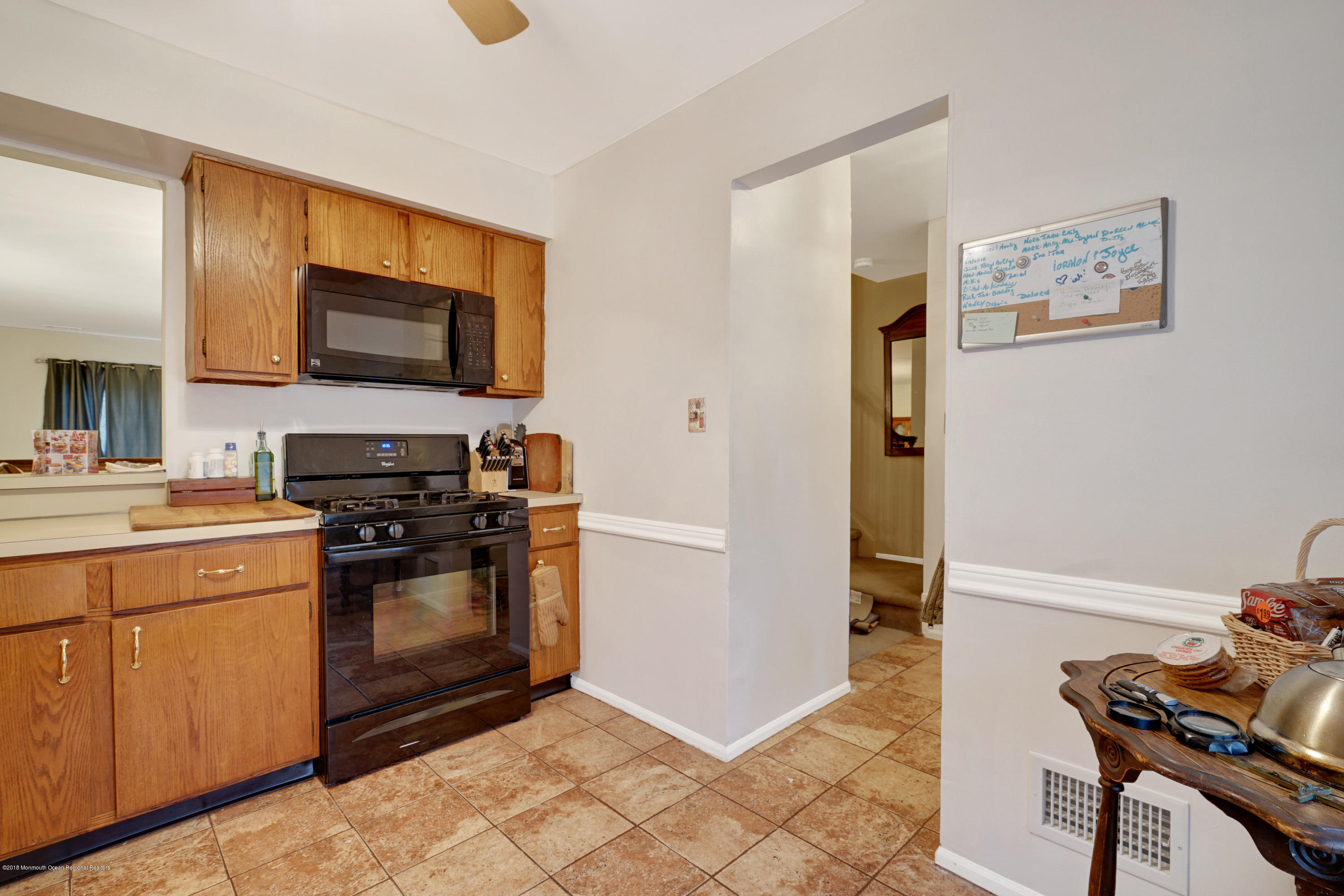 275 Gloucester Court Aberdeen, NJ 07747 - Photo 13 of 31 a kitchen with stainless steel appliances a stove microwave and a refrigerator