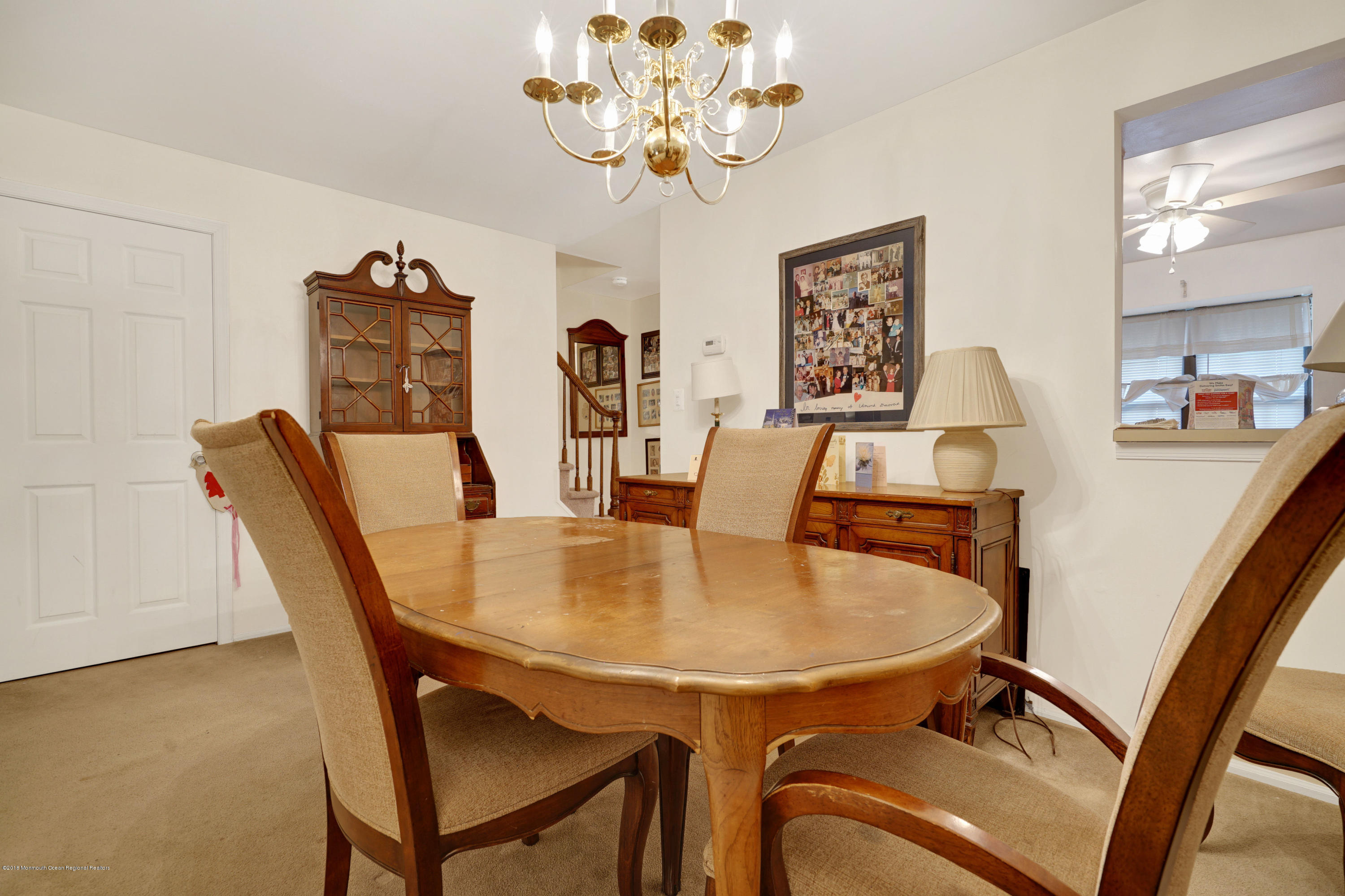 275 Gloucester Court Aberdeen, NJ 07747 - Photo 16 of 31 a dining room with furniture and chandelier