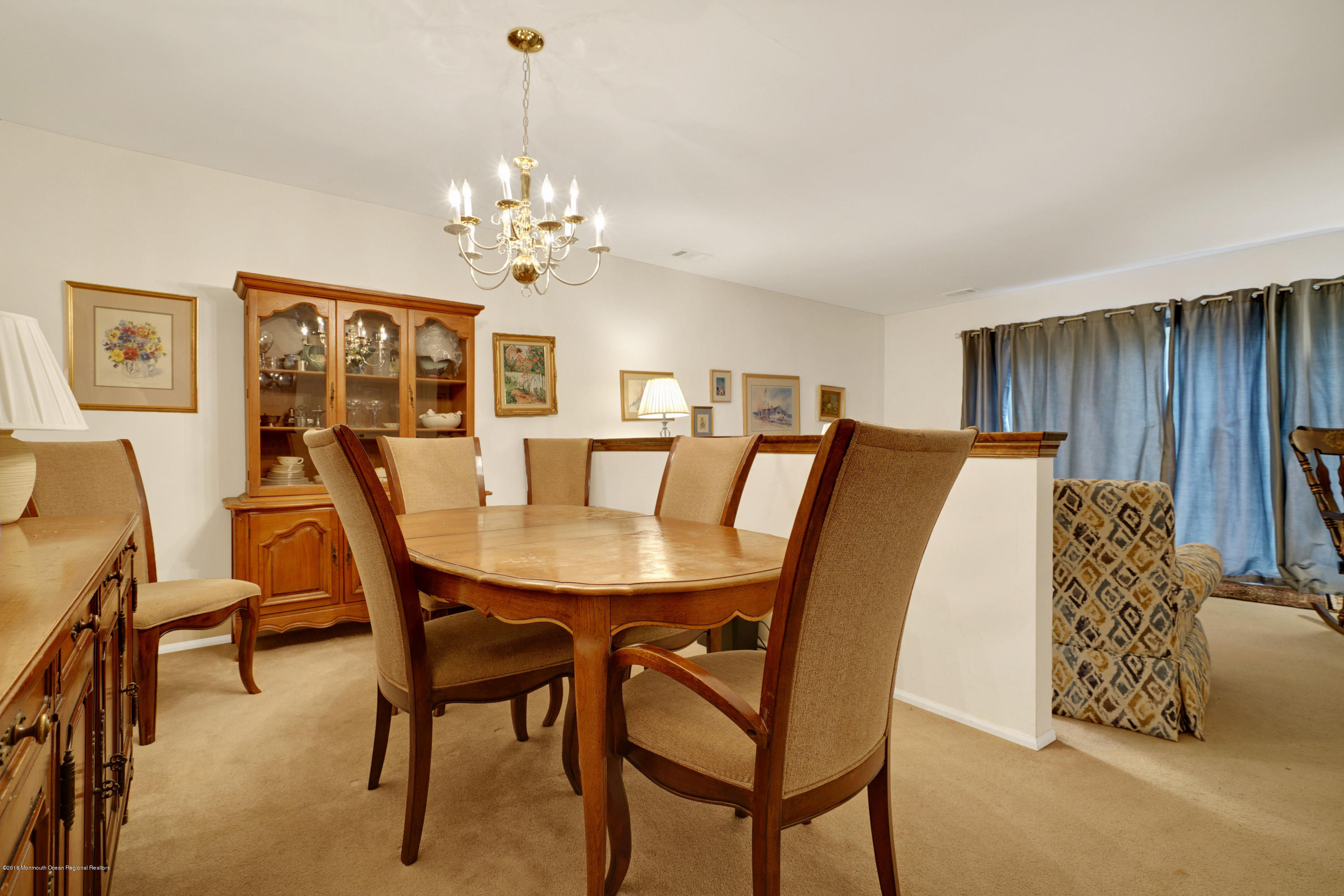 275 Gloucester Court Aberdeen, NJ 07747 - Photo 17 of 31 a view of a dining room with furniture and chandelier