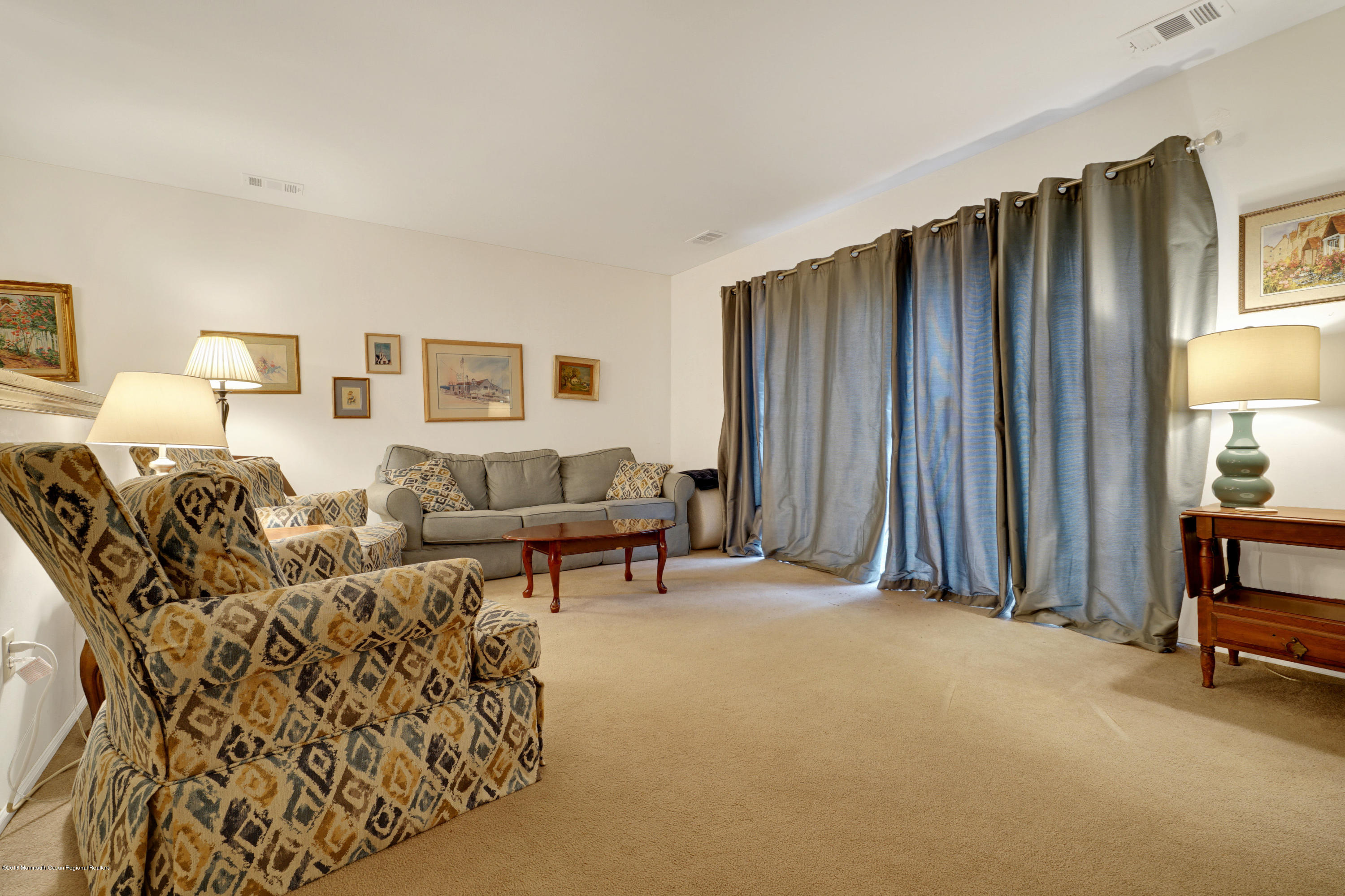 275 Gloucester Court Aberdeen, NJ 07747 - Photo 18 of 31 a living room with furniture and a window