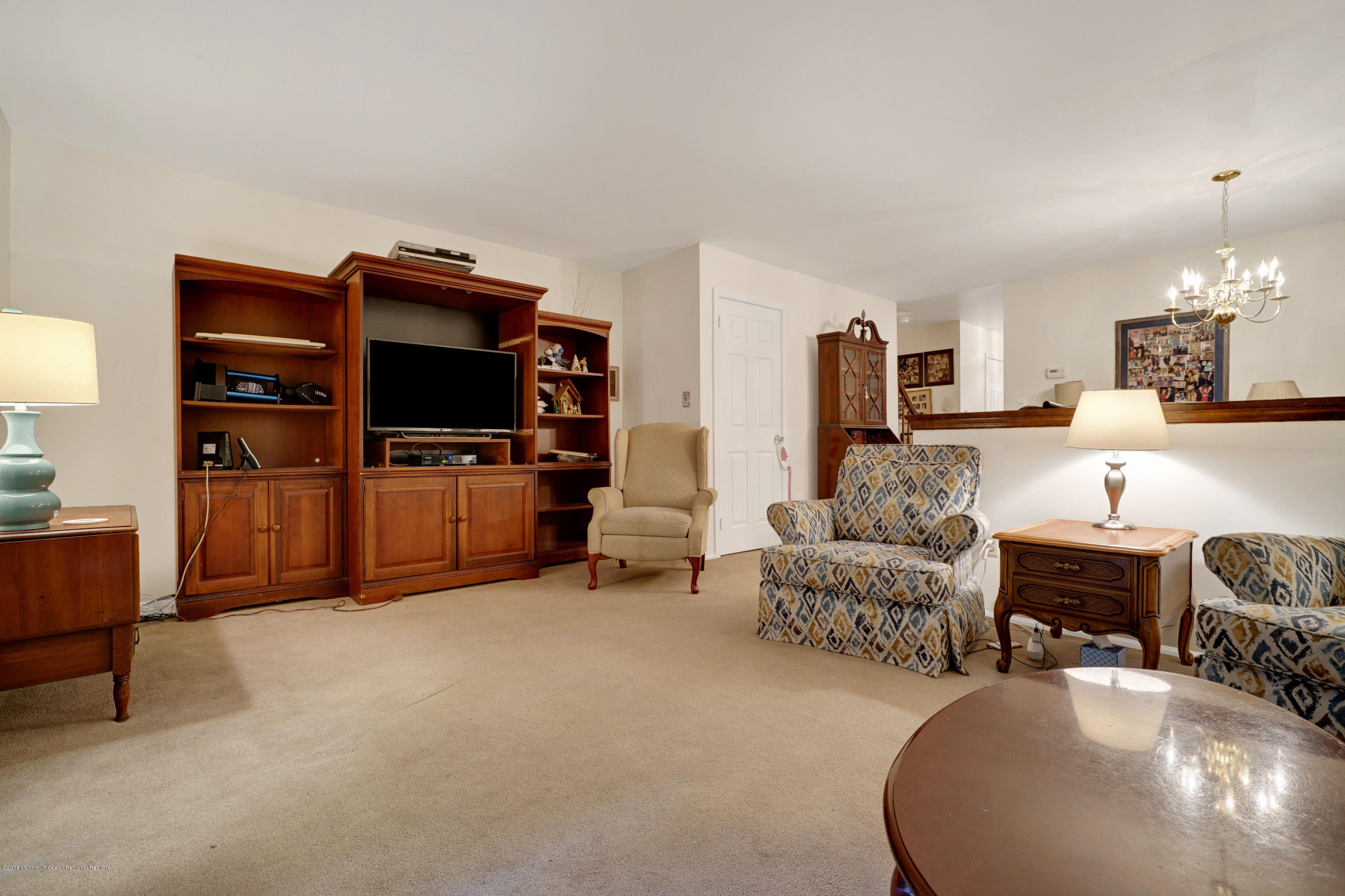 275 Gloucester Court Aberdeen, NJ 07747 - Photo 20 of 31 a living room with furniture and a flat screen tv