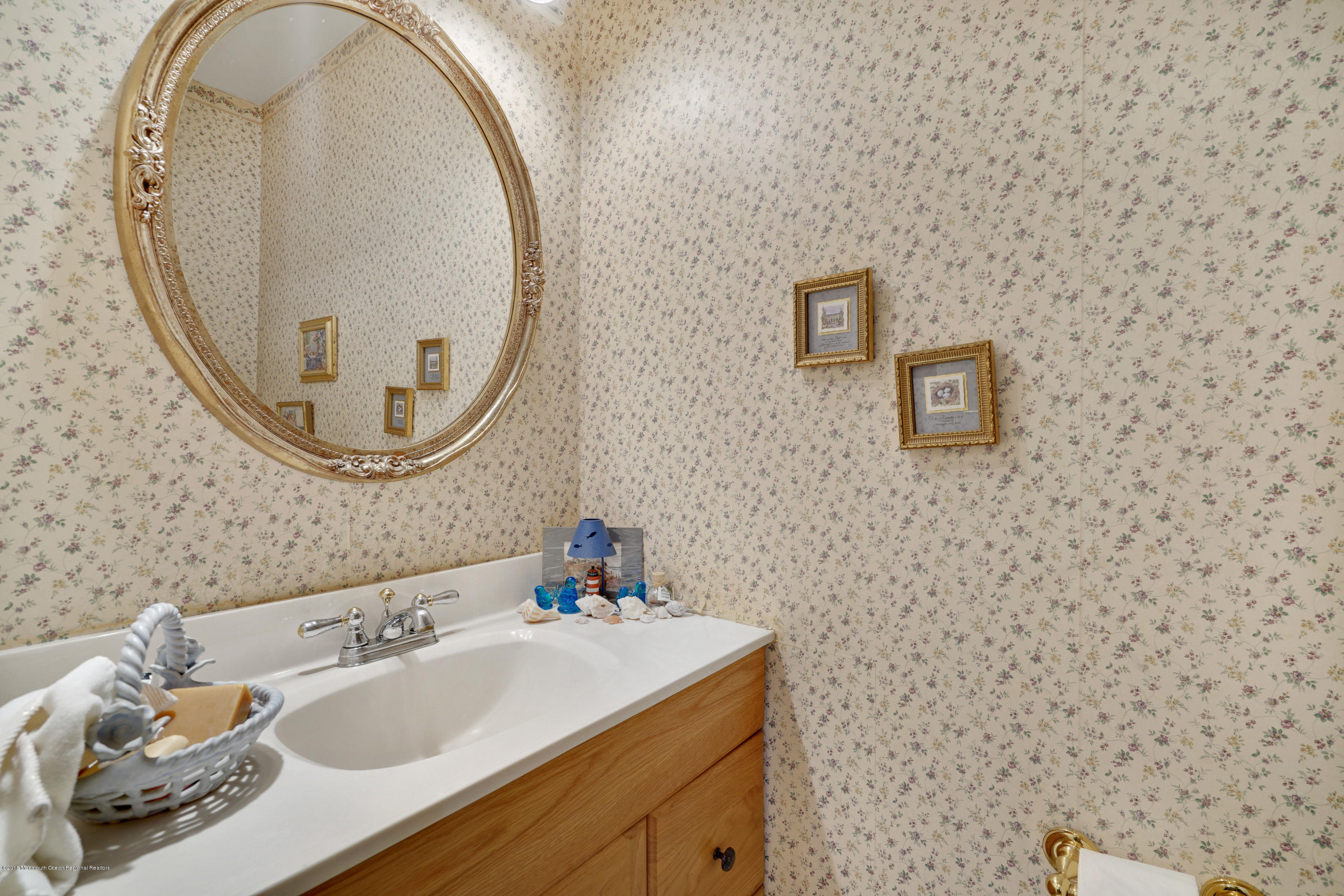 275 Gloucester Court Aberdeen, NJ 07747 - Photo 21 of 31 a bathroom with a sink and a mirror