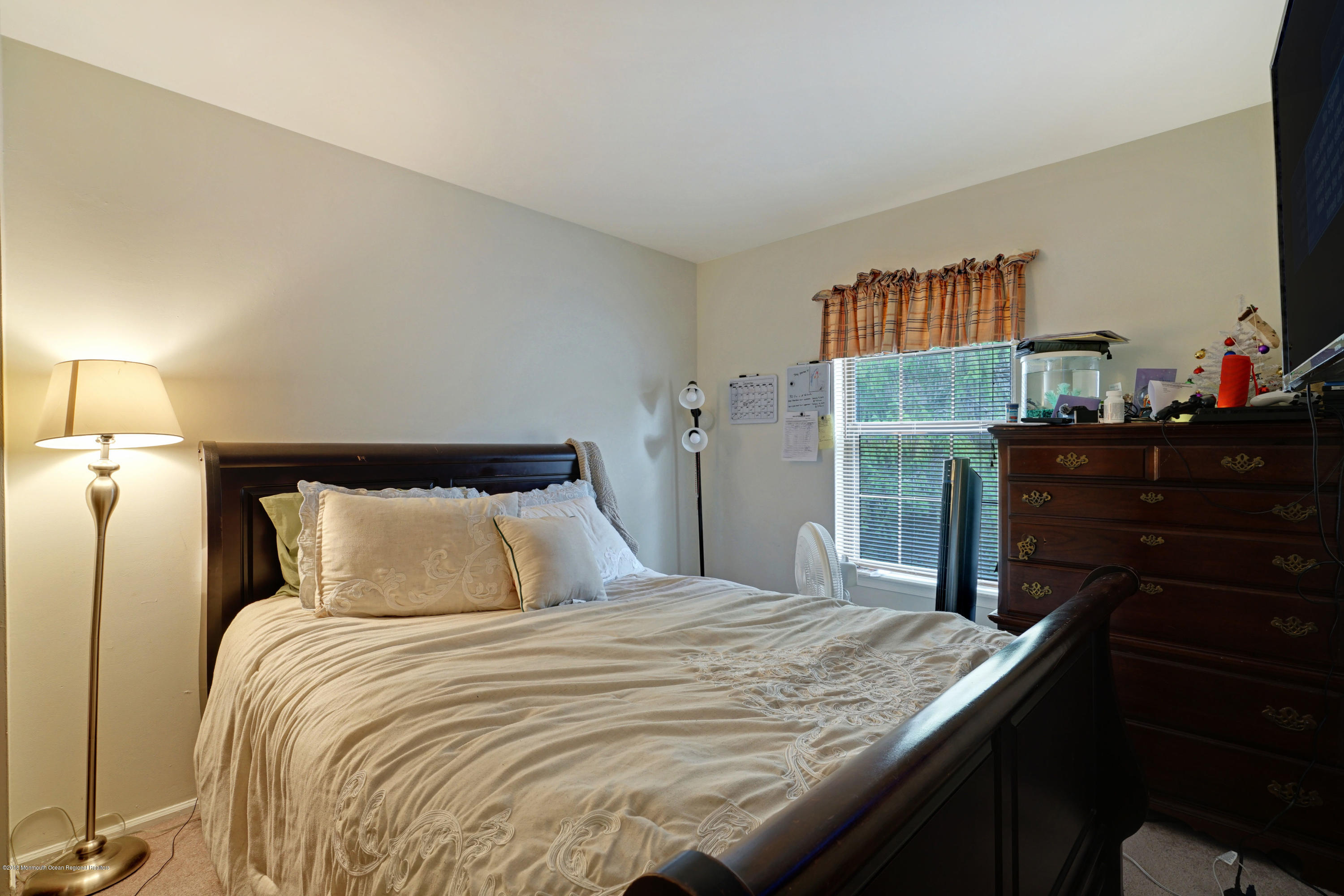 275 Gloucester Court Aberdeen, NJ 07747 - Photo 23 of 31 a bedroom with a bed and dresser