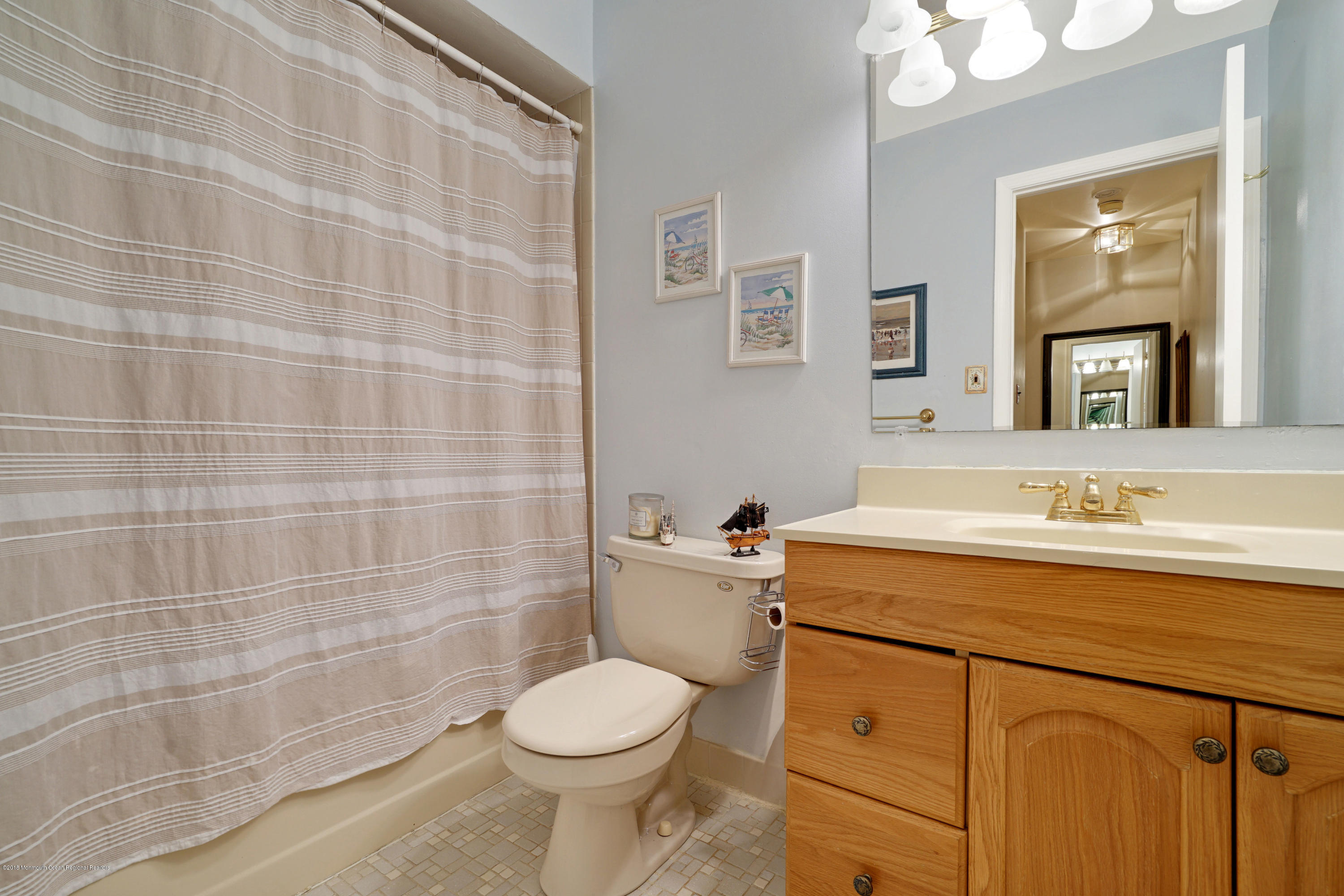 275 Gloucester Court Aberdeen, NJ 07747 - Photo 24 of 31 a bathroom with a sink a toilet and shower