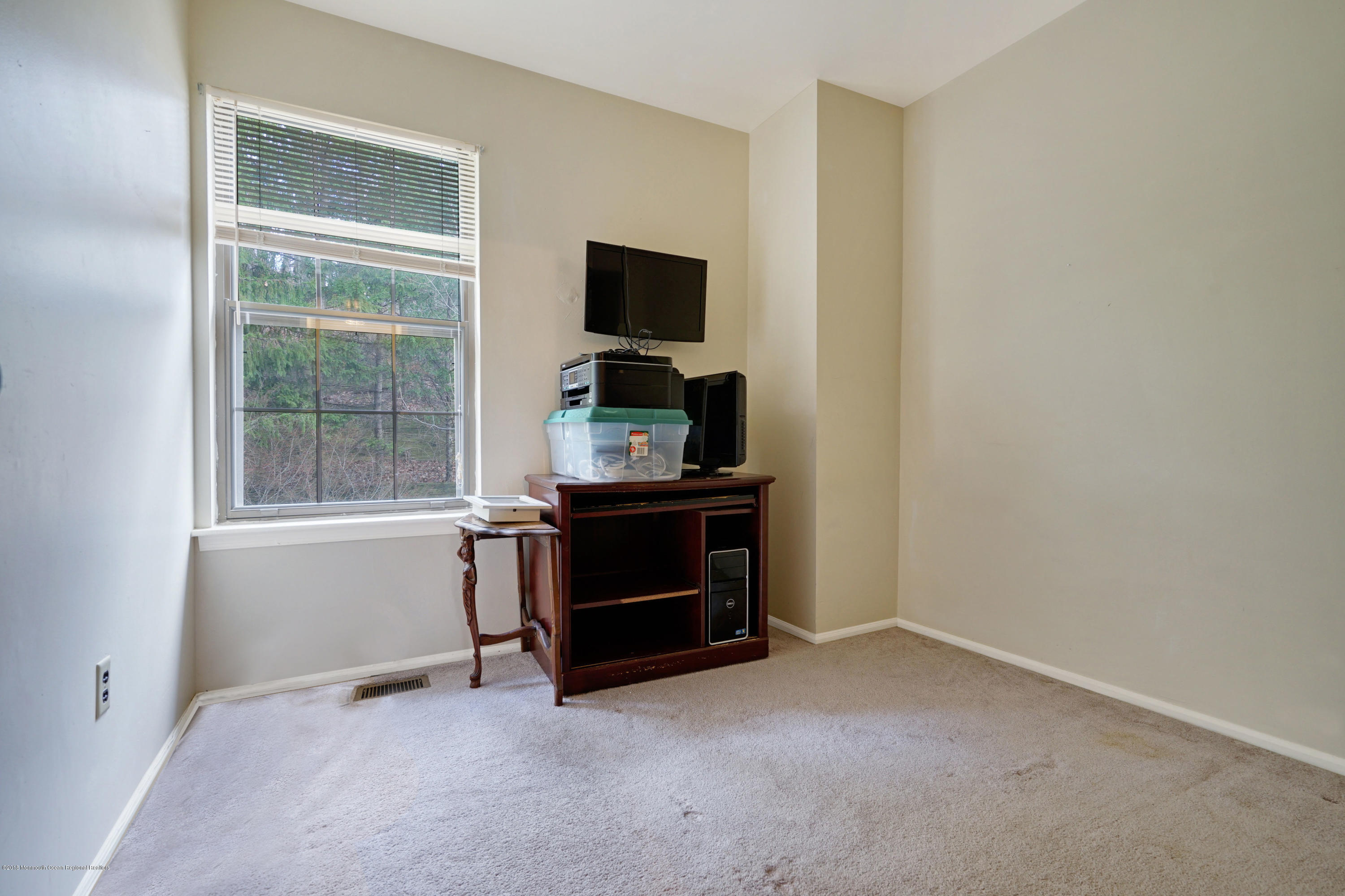 275 Gloucester Court Aberdeen, NJ 07747 - Photo 27 of 31 a room with a flat screen tv and kitchen view
