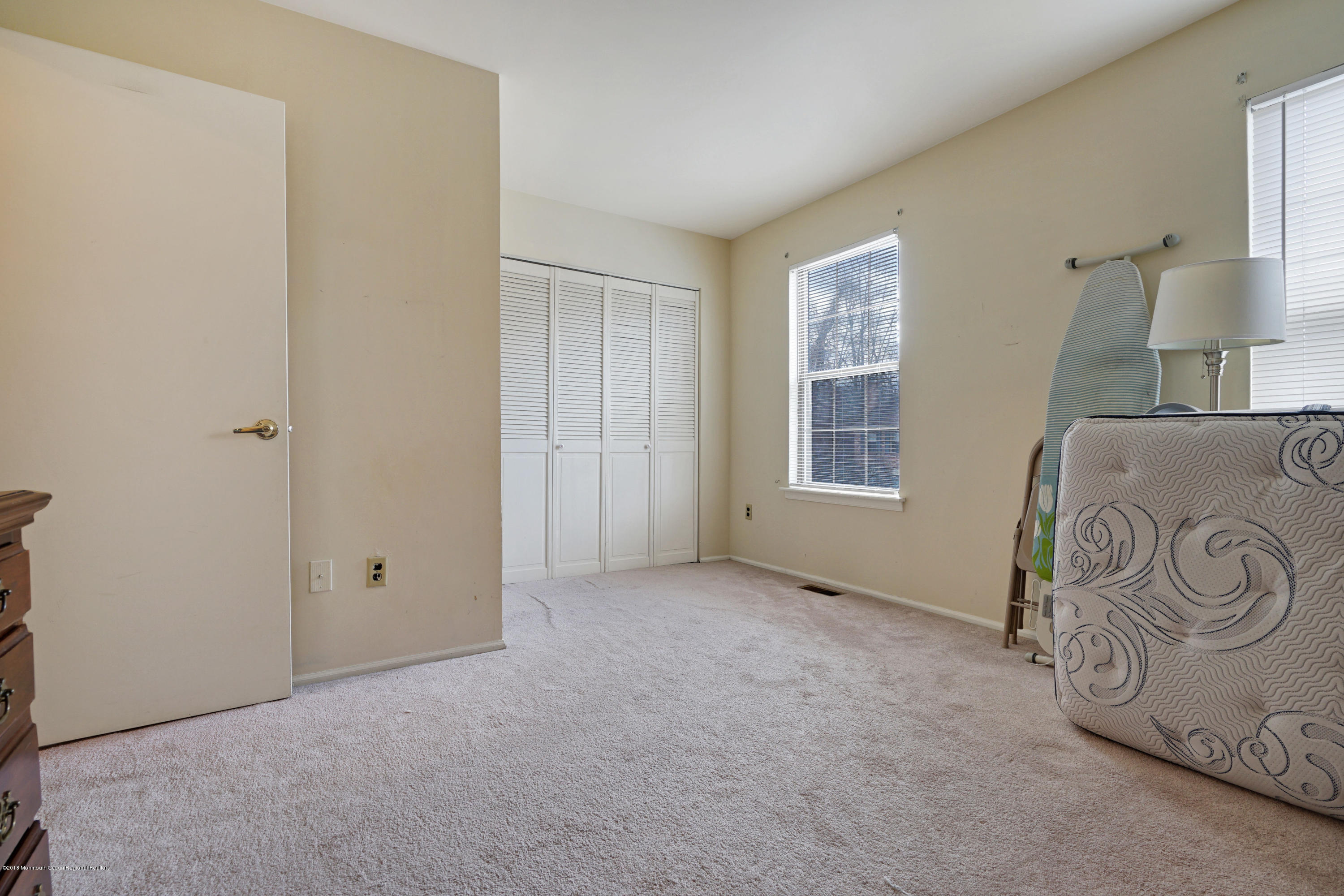 275 Gloucester Court Aberdeen, NJ 07747 - Photo 29 of 31 a view of an empty room with window and hardwood floor