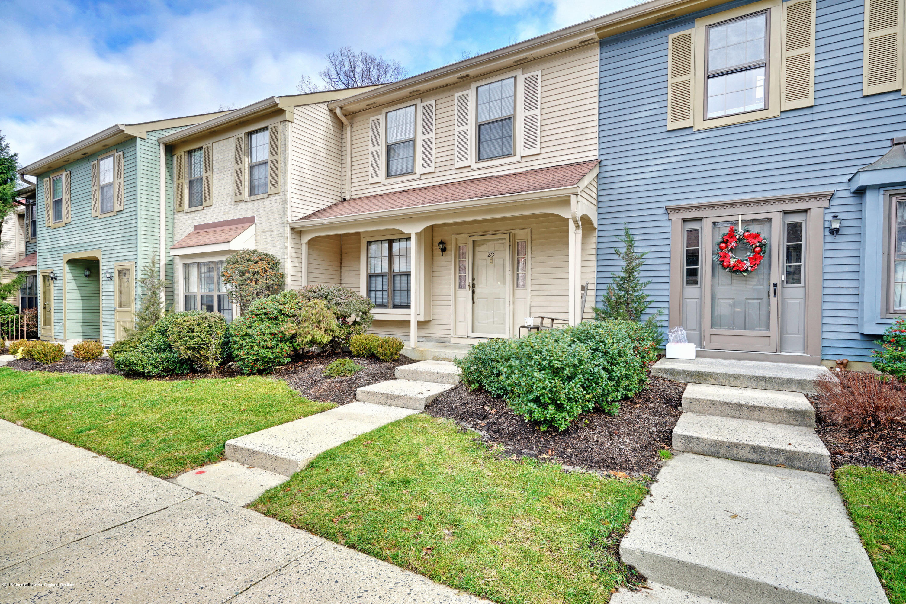 275 Gloucester Court Aberdeen, NJ 07747 - Photo 3 of 31 a front view of a house with garden
