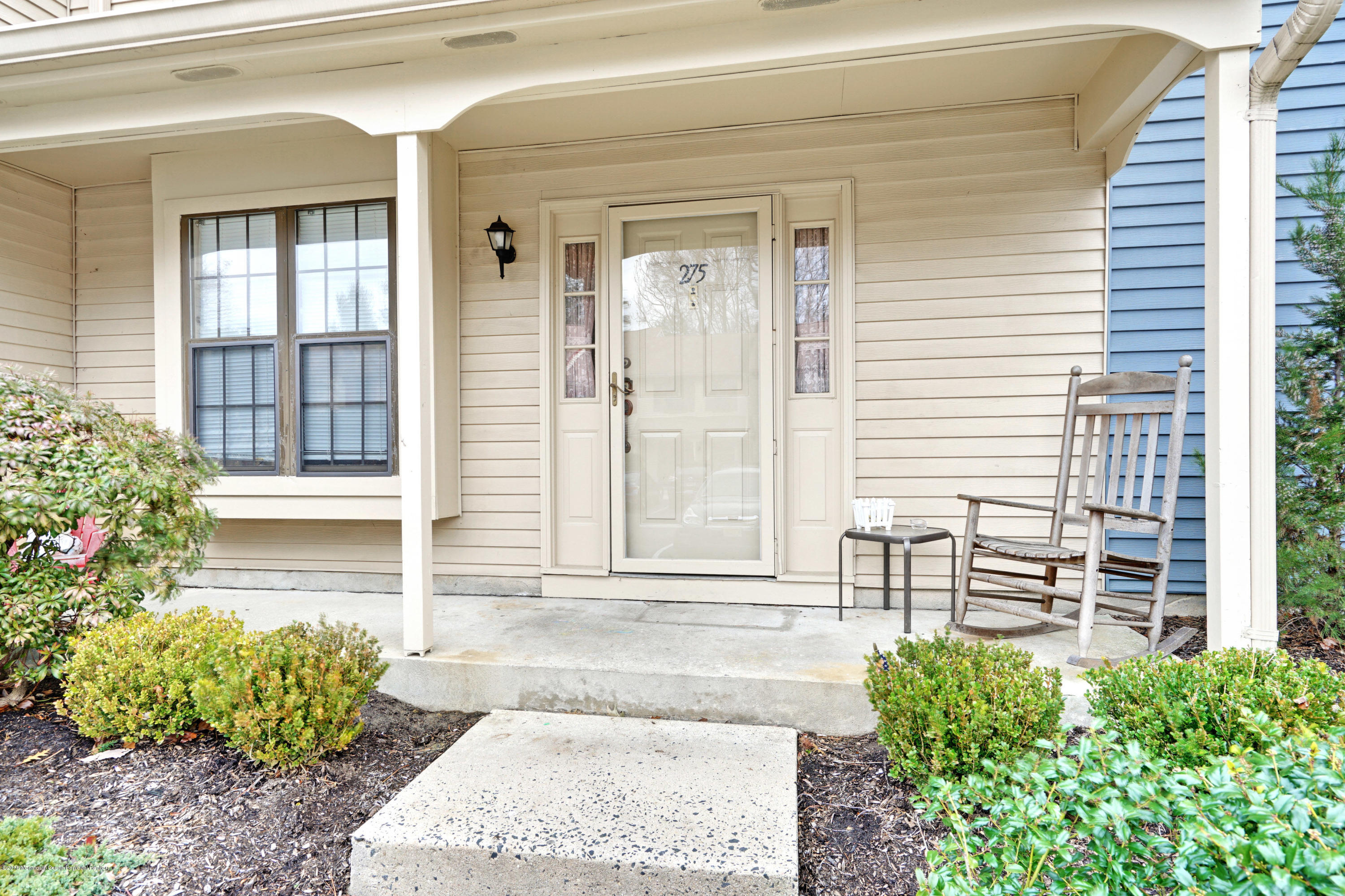 275 Gloucester Court Aberdeen, NJ 07747 - Photo 5 of 31 a front view of a house with a garden