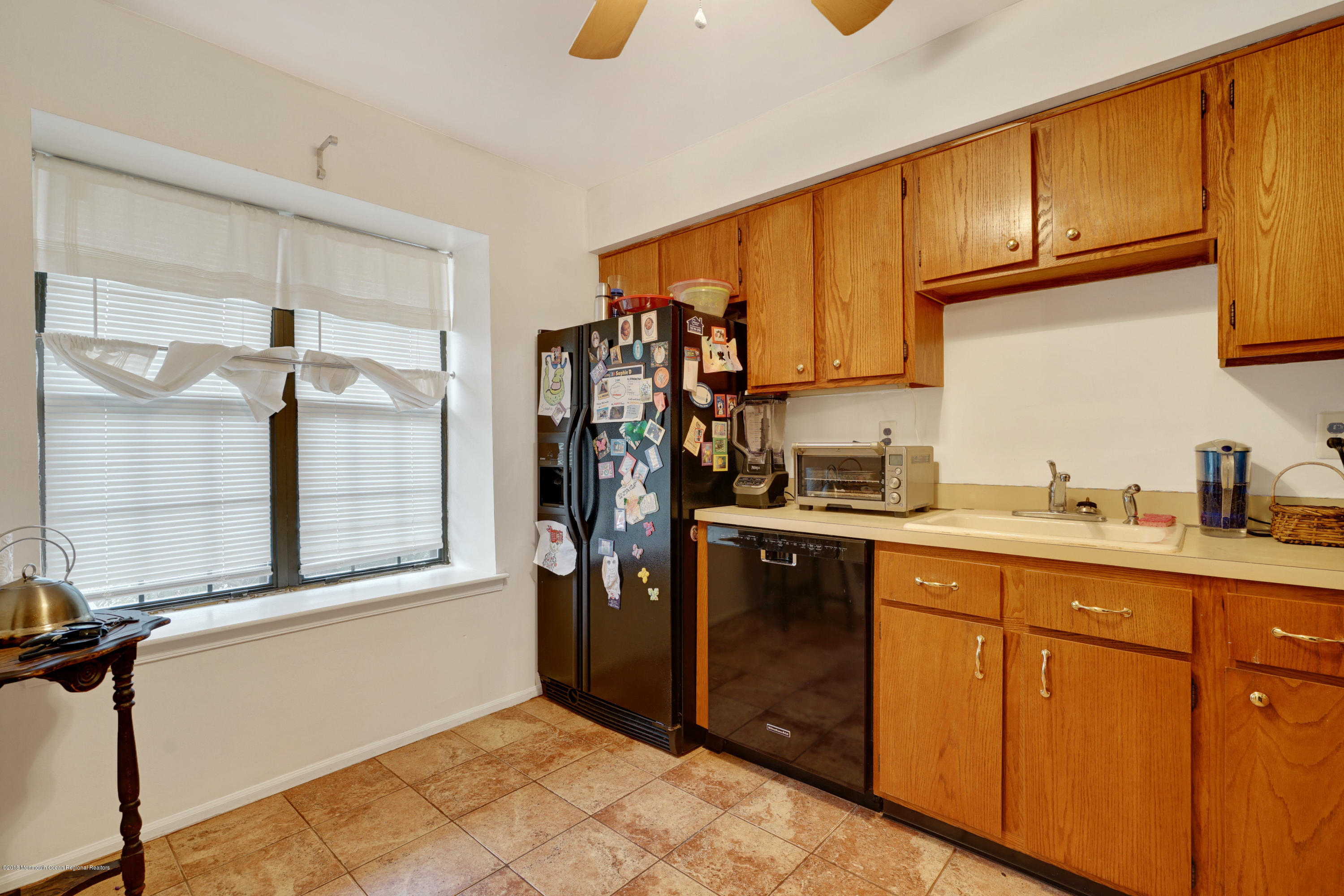 275 Gloucester Court Aberdeen, NJ 07747 - Photo 10 of 31 a kitchen with stainless steel appliances granite countertop a refrigerator and a sink