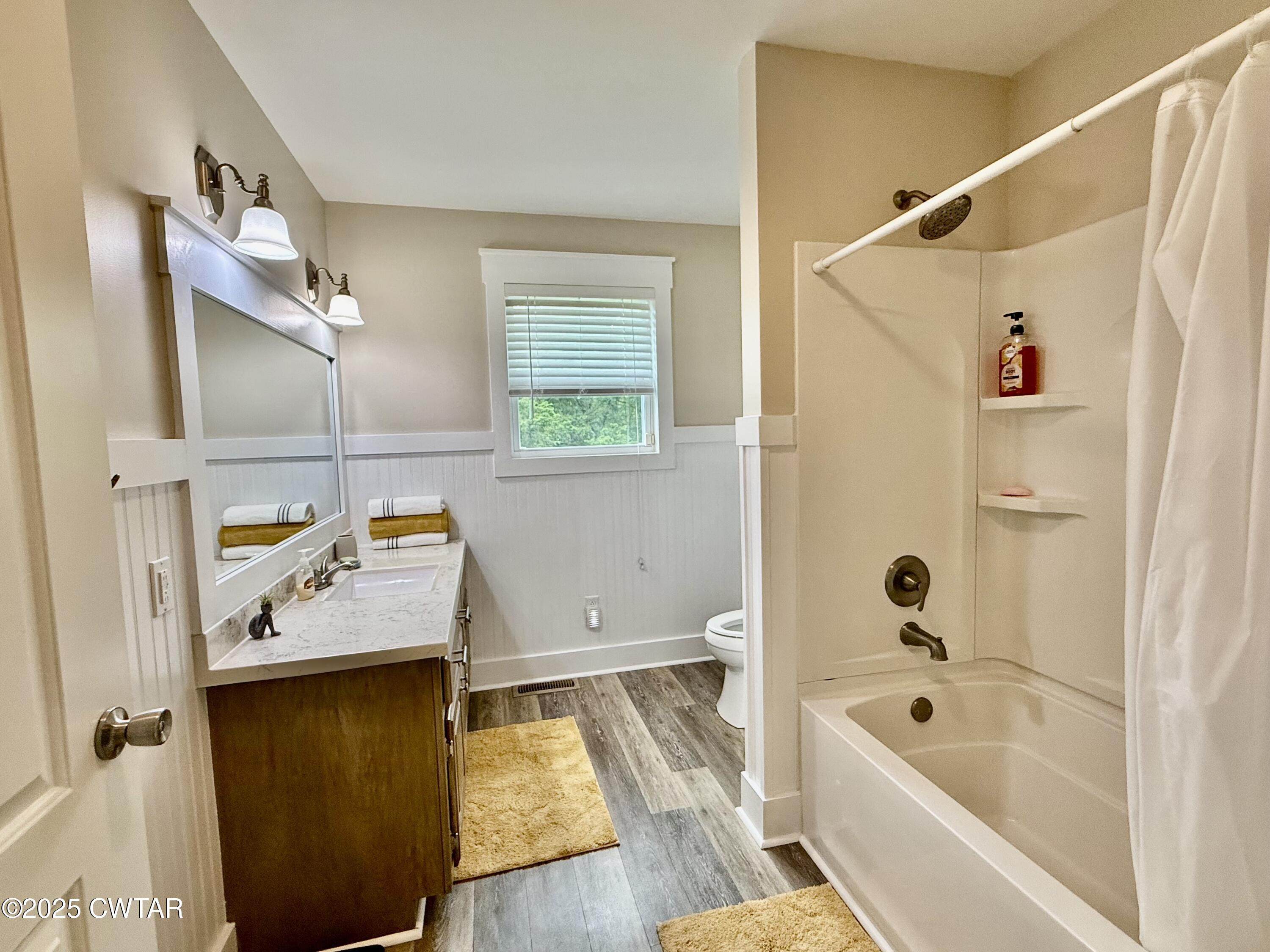 4815 Webb Store Road Hornbeak, TN 38232 - Photo 15 of 23 a bathroom with a tub sink and mirror