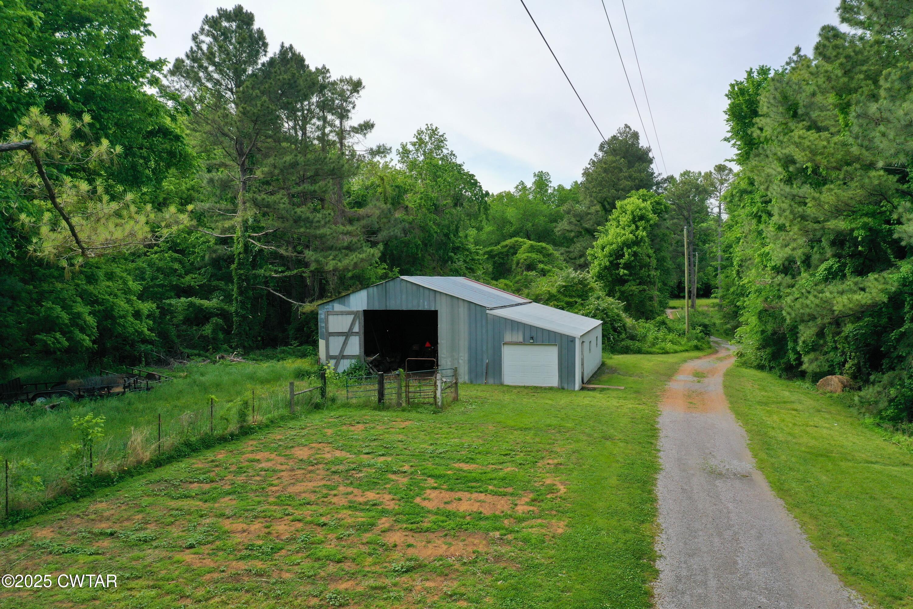 4815 Webb Store Road Hornbeak, TN 38232 - Photo 23 of 23 a view of a garden with a slide