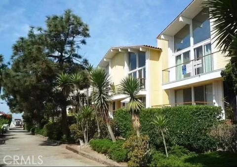 31 Spinnaker Street, Unit 15A Marina del Rey, CA 90292 - Photo 12 of 14 a front view of a multi story building with a yard