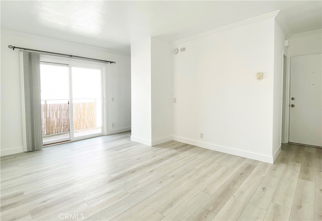 31 Spinnaker Street, Unit 15A Marina del Rey, CA 90292 - Photo 6 of 14 a view of an empty room with wooden floor and a window