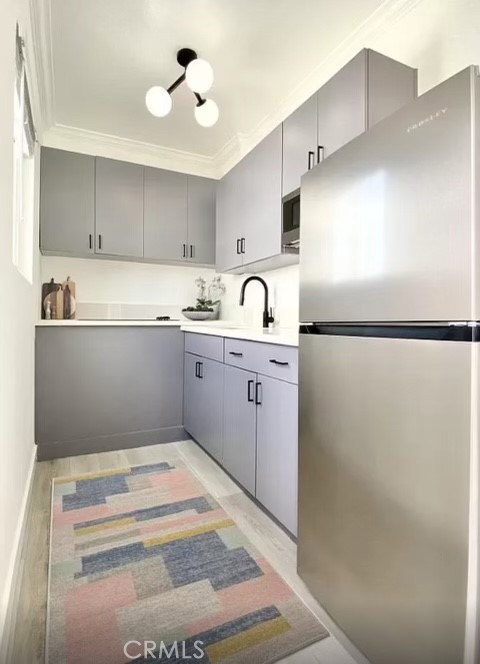 31 Spinnaker Street, Unit 15A Marina del Rey, CA 90292 - Photo 7 of 14 a kitchen with stainless steel appliances granite countertop a sink and a refrigerator
