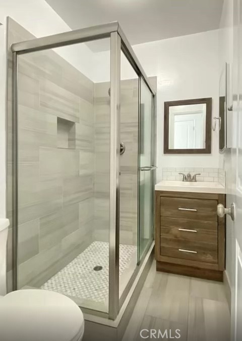 31 Spinnaker Street, Unit 15A Marina del Rey, CA 90292 - Photo 8 of 14 a bathroom with a shower sink and mirror