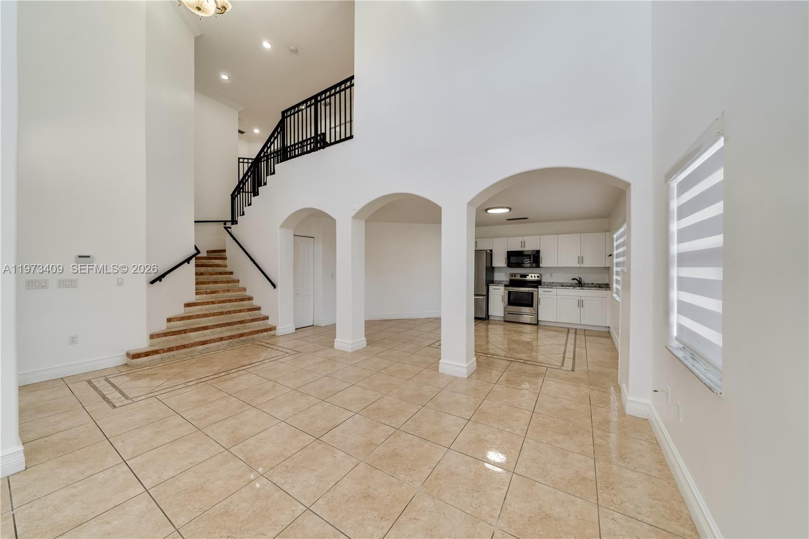 13050 Southwest 26th Street Miami, FL 33175 - Photo 7 of 43 a view of entryway and kitchen