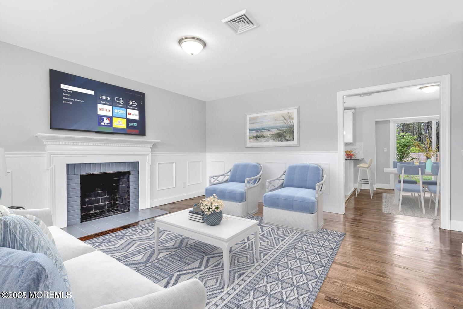 576 Francis Road Brick, NJ 08723 - Photo 4 of 9 a living room with furniture and a fireplace