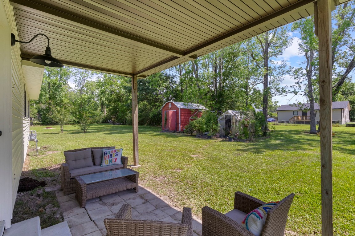 135 James Street Bridge City, TX 77611 - Photo 12 of 12 a view of a patio with chairs and a table