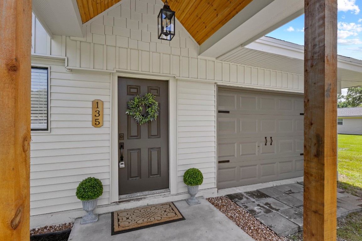 135 James Street Bridge City, TX 77611 - Photo 2 of 12 a view of a entryway door front of a house